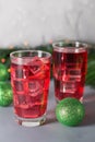 Glass of mango dragonfruit refresher drink on table with ice cubes. Copy space Royalty Free Stock Photo