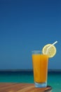 Glass of Mango Juice with Straw and Lemon Twist