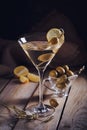 Glass of martini with green olives on a old wooden table Royalty Free Stock Photo