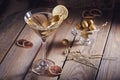 Glass of martini with green olives on a old wooden table Royalty Free Stock Photo