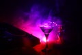 Glass with martini with olive inside on dj controller in night club. Dj Console with club drink at music party in nightclub with d