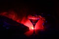 Glass with martini with olive inside on dj controller in night club. Dj Console with club drink at music party in nightclub with d