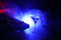 Glass with martini with olive inside on dj controller in night club. Dj Console with club drink at music party in nightclub with d Royalty Free Stock Photo