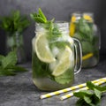 Glass mason jar of ice tea with fresh mint, lemon and paper straw on dark background. Summer healthy cold drink. Alternative Royalty Free Stock Photo