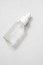 Glass matte bottle cosmetic droper on neutral background. Skin care oils, vitamins, collagen. Packaging of cosmetic beauty product