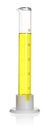 Glass measuring cylinder with yellow sample isolated