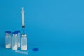 Glass medical ampoule vial for injection with syringe. Copy space.