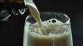 A glass of milk being poured into a bottle Generative AI Royalty Free Stock Photo