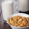 Glass of milk and bowl of cornflakes