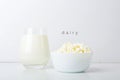 Glass of milk and bowl with homemade cottage cheese on a white background. The concept of healthy dairy products with calcium. Royalty Free Stock Photo