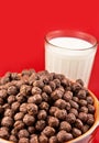 Glass with milk and chokolate balls