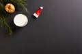 Glass of milk, christmas cookies and santa hat with copy space on black abackground Royalty Free Stock Photo