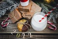 A glass of milk, cookies, santa hat, numbers 2022 and gifts on the table. Royalty Free Stock Photo