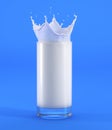 Glass of milk with crown splash. Full view, on blue background Royalty Free Stock Photo