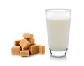 Glass of milk and cubes of cane sugar