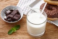 Glass of milk with donuts and chocolate bar Royalty Free Stock Photo