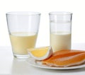 Glass of milk and fish oil, cut out on white background Royalty Free Stock Photo