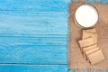 Glass of milk with grain crispbreads on a blue wooden background with copy space for your text. Top view Royalty Free Stock Photo