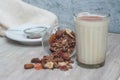 Glass of Milk with Granola Cereals with Dried Fruits overRustic Wodden Board. Healthy Food Breakfast. Royalty Free Stock Photo