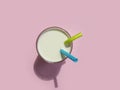 Glass of milk, pipe stream nutrient   concept  on a colored background health beverage Royalty Free Stock Photo