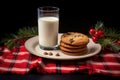 a glass of milk and plate of cookies set out for santa