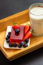 A glass of milk and a slice of strawberry cake with strawberries Royalty Free Stock Photo