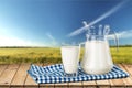 Glass of milk and bottle on background Royalty Free Stock Photo