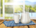 Glass of milk and bottle on background Royalty Free Stock Photo