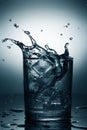 Glass of mineral water with ice and splash Royalty Free Stock Photo