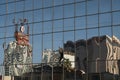 Glass mirror windows with reflections of buildings and patterns