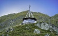 A glass monument high in the mountains