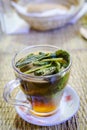 A glass of Moroccan mint tea placed on the dining table