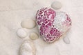 Glass Mosaic Heart In White Sand Royalty Free Stock Photo