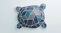 Glass or a mosaic pieced together to form a stylized turtle against Royalty Free Stock Photo