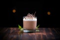 glass of mousse with dark cocoa background