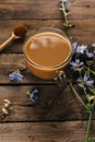 Glass mug with chicory drink on wooden background