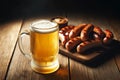 glass mug of foamy beer and grilled sausages on a wooden board Royalty Free Stock Photo