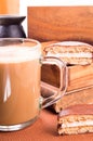 Glass mug with hot chocolate on a table and biscuits Royalty Free Stock Photo