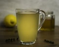 Glass Mug of Hot Lemon, Honey and Ginger Drink with sprigs of Thyme as a cold remedy Royalty Free Stock Photo