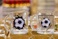 Glass mugs for football fans. Goods on the store shelf, supermarket showcase. April 14, 2022 Balti Moldova.