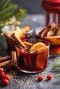 Glass mugs of mulled wine with spices and citrus fruits. Traditional hot drink or beverage, festive cocktail at X-mas or New Year Royalty Free Stock Photo