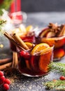 Glass mugs of mulled wine with spices and citrus fruits. Traditional hot drink or beverage, festive cocktail at X-mas or New Year Royalty Free Stock Photo