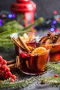 Glass mugs of mulled wine with spices and citrus fruits. Traditional hot drink or beverage, festive cocktail at X-mas or New Year Royalty Free Stock Photo