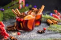 Glass mugs of mulled wine with spices and citrus fruits. Traditional hot drink or beverage, festive cocktail at X-mas or New Year Royalty Free Stock Photo