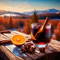 Glass of mulled red wine against snowy winter landscape