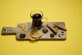 A glass of mulled wine on a wooden board with cinnamon sticks and lemon. Top view. Yellow background Royalty Free Stock Photo