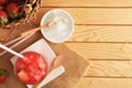 Glass of natural iced strawberry juice on wooden table top Royalty Free Stock Photo