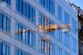 Glass office building elevatio with yellow tower crane reflection Royalty Free Stock Photo