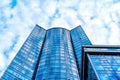 Glass Office Tower Under Blue Sky with Cloud Reflections Royalty Free Stock Photo
