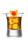 Glass with old fashioned cocktail and pick with cocktail cherry and orange peel on white background Royalty Free Stock Photo